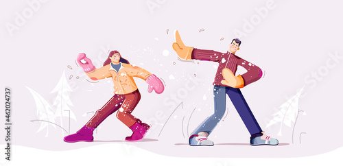 Snowball fight. Youth are playing in snow. Snowy winter landscape.