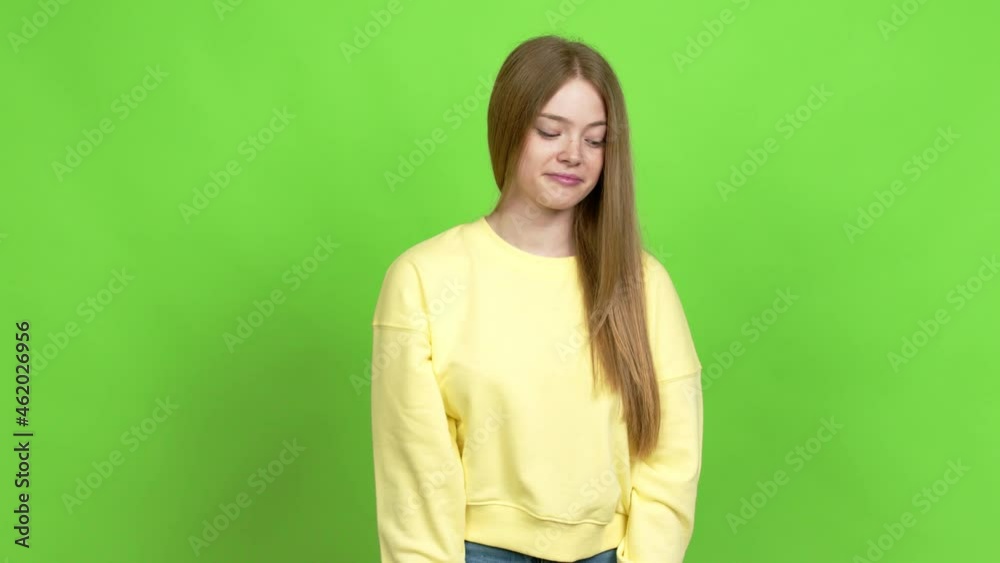 Teenager girl doing silence gesture over isolated background. Green screen chroma key Teenager girl doing silence gesture over isolated background. Green screen chroma key