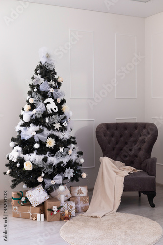 Christmas tree with gift boxes. New Year's decorations. New Year's interior.