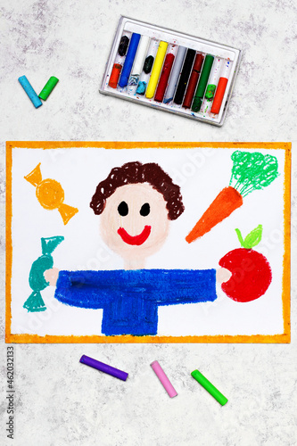Colorful drawing: Boy and sweets and vegetables around him. The problem of childhood obesity
