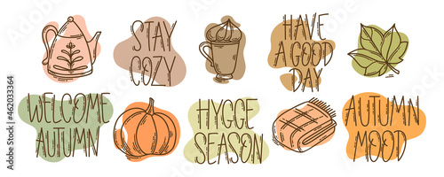 Set of hand-drawn autumn hygge mood vector icons in doodle style and lettering. Cozy cute cartoon elements collection and motivational phrases isolated on white background for seasonal decoration.