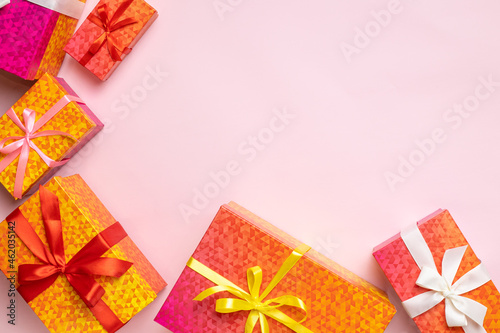 Top view of gift boxes frame for celebration Christmas, Birthday or New Year on pink background