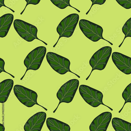 Seamless pattern Spinach salad on light green background. Modern ornament with lettuce.