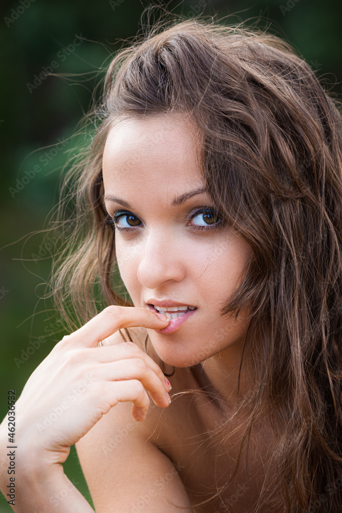 Portrait of an young woman on natural background Portrait of an young woman on natural background
