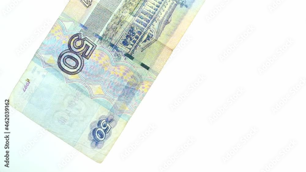 paper banknotes of the Russian Federation, money Russian rubles falling on the table from above, scattering, slow motion, the concept of banking operations, devaluation paper banknotes of the Russian Federation, money Russian rubles falling on the table from above, scattering, slow motion, the concept of banking operations, devaluation
