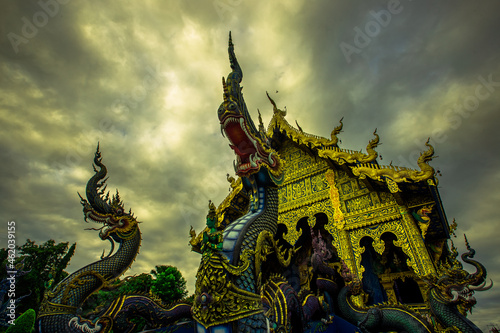 Background Chiang Rai Blue Temple or Wat Rong Seua Ten is located in Rong Suea Ten in the district of Rimkok a few kilometers outside Chiang Rai,Thailand photo