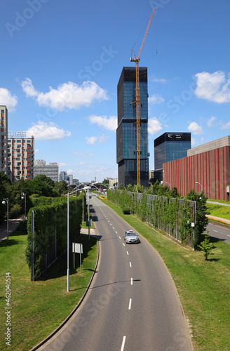 View to Walentego Rozdzienskiego Alley on the height of the footbridge. Cityscape, KTW office buildings and Katowice Cultural Zone on the right. Vertical image. Silesia, Poland. photo