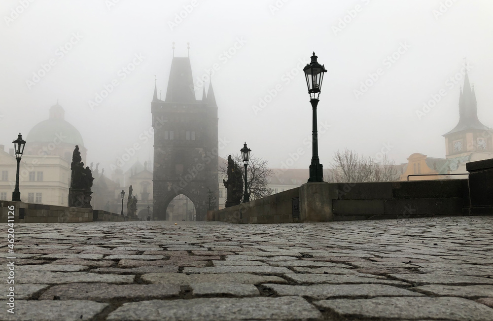 Fotografie Foggy tower on medieval bridge