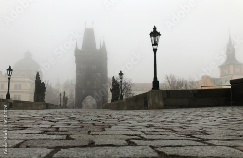 Photography Foggy tower on medieval bridge