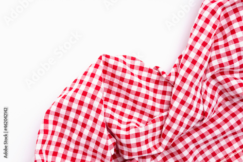 Fabric textile crumpled on white background with copy space. Tablecloth picnic Red, white texture checkers on white background.