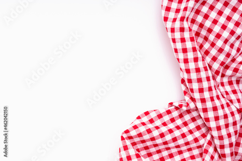 Fabric textile crumpled on white background with copy space. Tablecloth picnic Red, white texture checkers on white background.