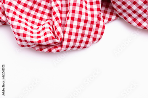 Fabric textile crumpled on white background. Tablecloth picnic Red, white texture checkers.