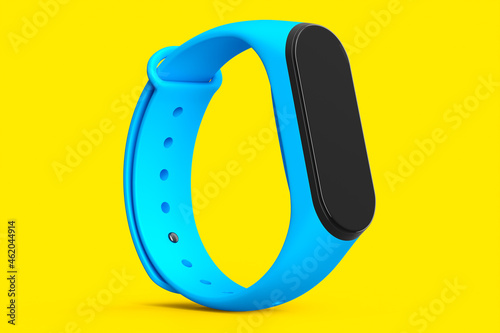 Blue fitness tracker or smart watch with heart rate monitor isolated on yellow