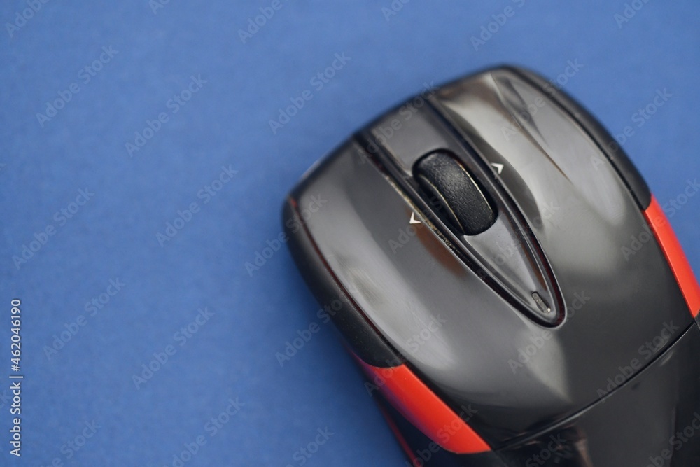 Photo of a black and red computer mouse Photo of a black and red computer mouse
