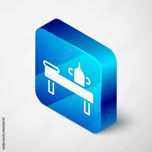 Isometric Massage table with oil icon isolated on grey background. Blue square button. Vector