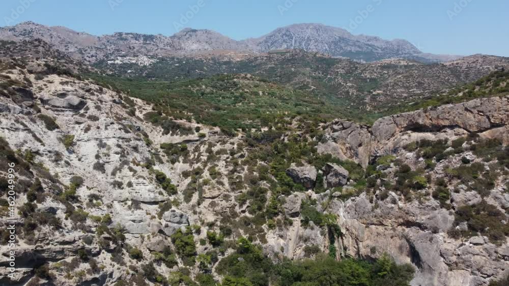 Greece, Crete, landscape with olive trees and tiny mountain village Greece, Crete, landscape with olive trees and tiny mountain village