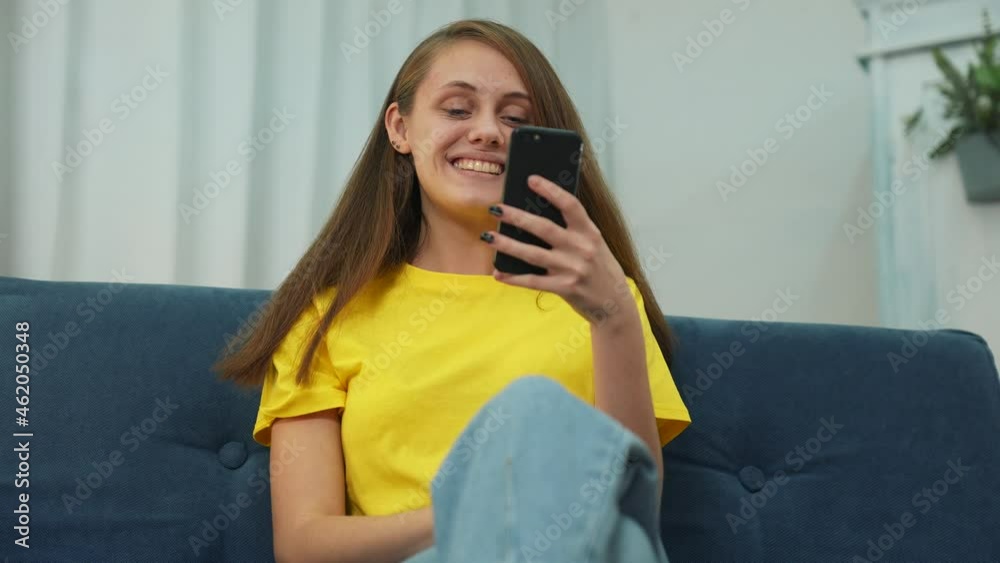 Happy girl Celebrating Success.Girl with smartphone.Business woman celebrating success with mobile phone.Internet using smartphone.Happy girl is winner.Lady celebrating success while sitting in office Happy girl Celebrating Success.Girl with smartphone.Business woman celebrating success with mobile phone.Internet using smartphone.Happy girl is winner.Lady celebrating success while sitting in office