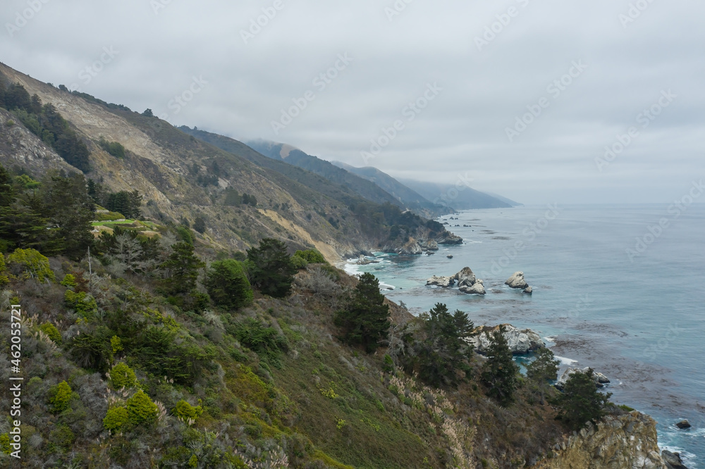 Aerial view of a Pacific Ocean shoreline with hills and trees near Big Sur, California Aerial view of a Pacific Ocean shoreline with hills and trees near Big Sur, California