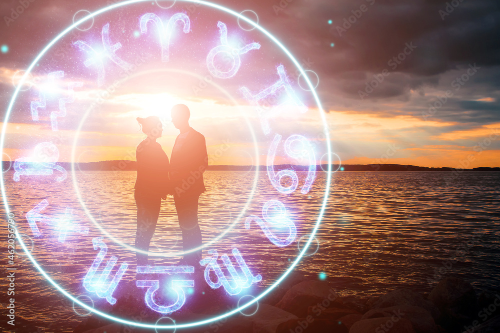 © Aliaksandr Marko - Horoscope concept, couple guy and girl on the background of a circle with the signs of the zodiac, astrology. Conceptual photo of a couple with perfect match between the signs of the zodiac.