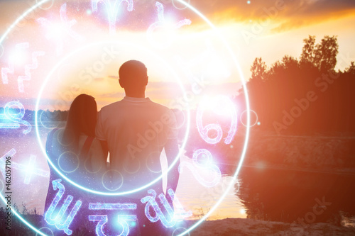 Horoscope concept  couple guy and girl on the background of a circle with the signs of the zodiac  astrology. Conceptual photo of a couple with perfect match between the signs of the zodiac.
