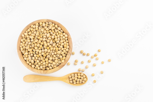 Soybean in wooden bowl and spoon on white background with free copy space 