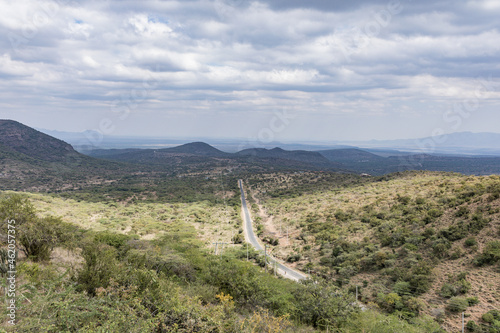 Magadi Road in the middle of the forest mountains hills cloudy plants vegetation field meadows great rift valley province kajiado county Kenya east Africa landscapes travel photo