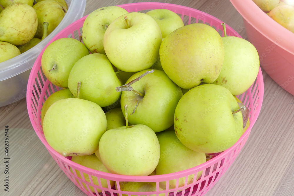ripe yellow apples in a basket,all natural hormone-free apples, ripe yellow apples in a basket,all natural hormone-free apples,