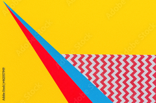 Abstract geometric fashion papers texture background in yellow  red  pink  blue colors. Top view  flat lay