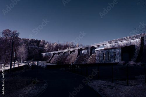 Fototapeta Naklejka Na Ścianę i Meble -  infrared photography - surreal ir photo of landscape with trees under cloudy sky - the art of our world and plants in the invisible infrared camera spectrum