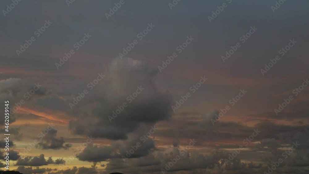 Scene of Colorful romantic red sky sunset with Changing the color of the sky background. .beautiful large red cloud at sunset above Phuket city..beautiful red sky at sunset nature and travel concept
