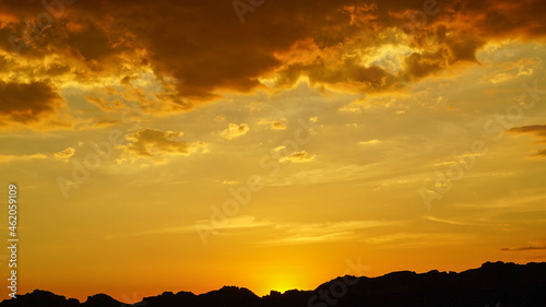 Photo of a beautiful golden sunset in the sky