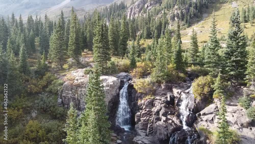 Aerial of two waterfalls in large valley by Colorado Rocky Mountains Aerial of two waterfalls in large valley by Colorado Rocky Mountains