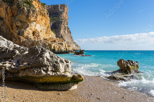 Mediterranean sea clear blue water and steep limestone cliffs travel Spain Cala Moraig Cumbre del Sol