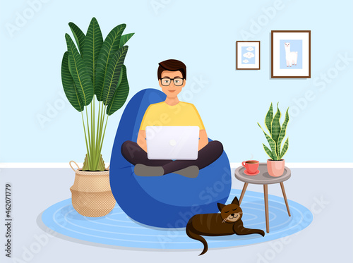 Man is sitting on a bean bag chair at home at a laptop computer. Remote work, office at home, programming, freelance. Study at home in quarantine. Vector illustration. Cozy interior with a cat.