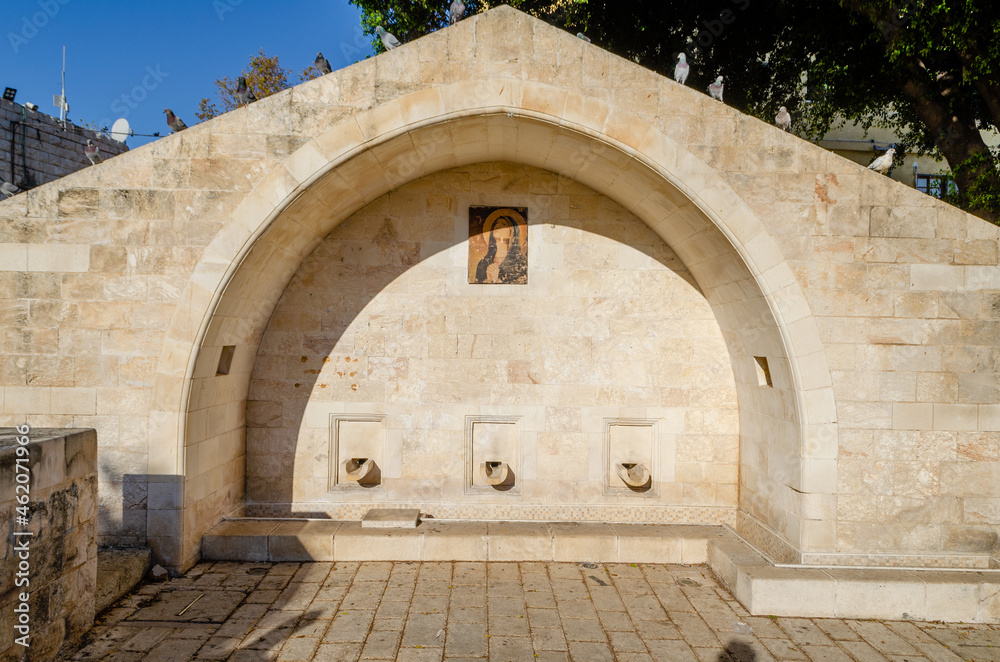 Naklejka premium Mary's Well in Nazareth surrounded by pigeons. Nazareth, Israel.