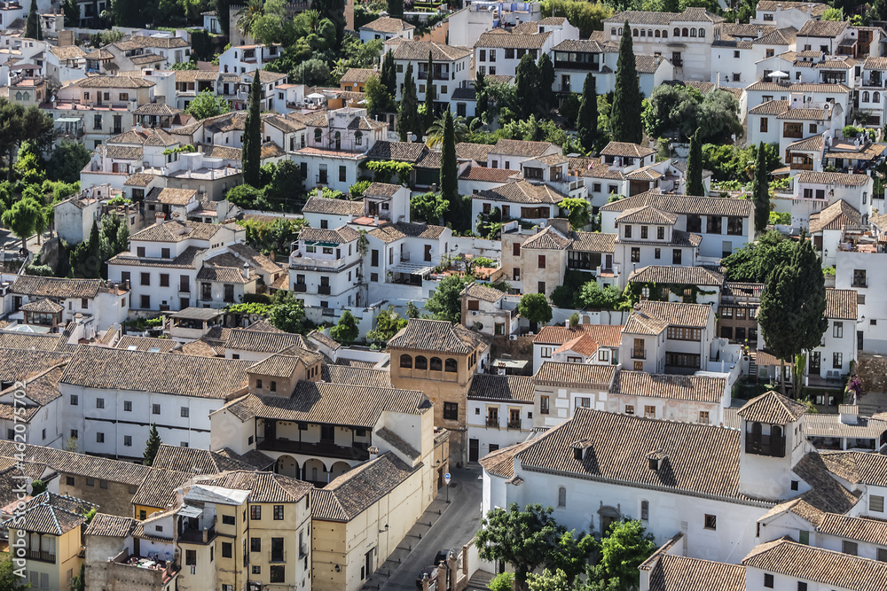 Beautiful aerial view city of Granada in a daytime. Granada - capital city of province of Granada, located at foot of Sierra Nevada Mountains. Granada, Andalusia, Spain.