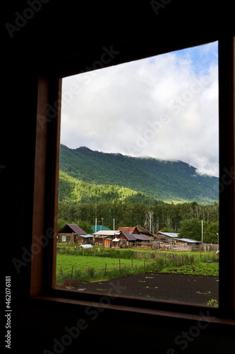 Holistay house. Countryside hiking. Window view. Vacation landscape. Russian Altai mountains. Staycation concept. Reduce carbon footprint. Sustainable lifestyle. Holiday trail. Local travel