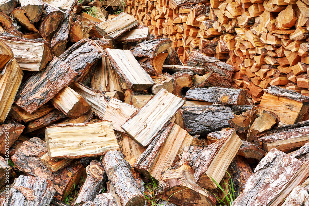 Wood chop stove. Woodpile texture background. Trees store. Hardwood pile stack. Wooden biomass wall. Split forest. Agriculture work Wood chop stove. Woodpile texture background. Trees store. Hardwood pile stack. Wooden biomass wall. Split forest. Agriculture work