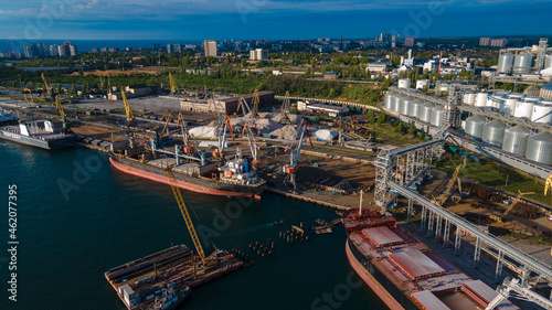 Industrial port in the field of import-export global business logistics and transportation, Loading and unloading container ships, cargo transportation from a bird's eye view. © Андрей Трубицын