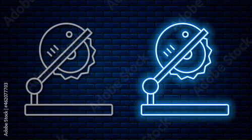 Glowing neon line Table saw for woodwork icon isolated on brick wall background. Power saw bench. Vector