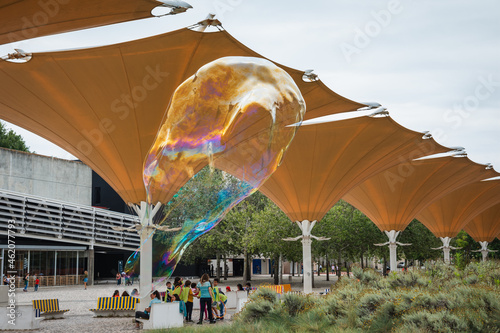 soap bubble in front of the building photo