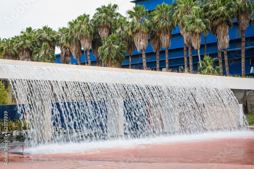 a waterfall in front of the building