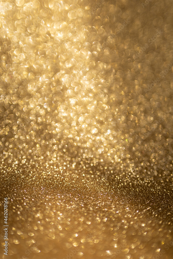 Golden glitter background with small particles Golden glitter background with small particles