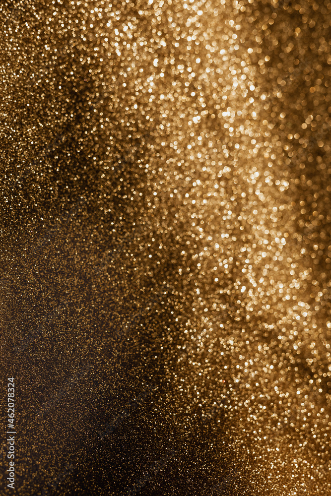 Golden glitter background with small particles