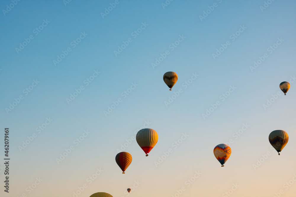 Naklejka premium Hot air balloons on the sky in the morning. Magical view with hot air balloons.