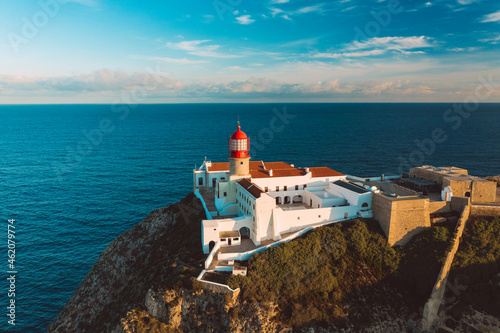 Aerial view of Lighthouse of Cabo De Sao Vicente or Cape of Saint Vincent located on high cliffs near Atlantic ocean photo