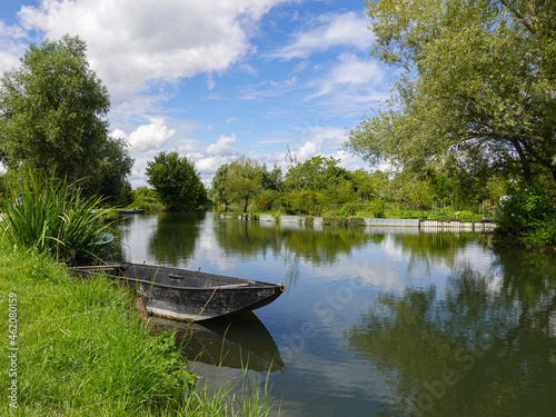 Old wooden small boat on the Yèvre in the marshes of Bourges.
