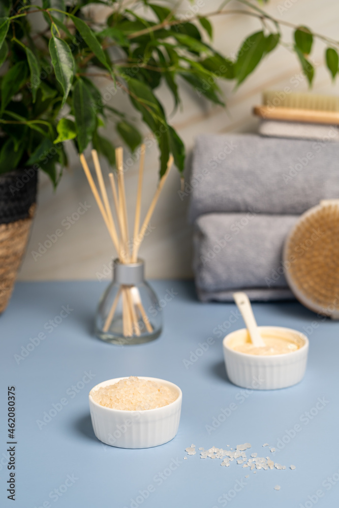 Spa concept, body care. Bath towels, sea salt, cream and brush for body. High quality photo