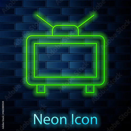 Glowing neon line Football soccer match on TV icon isolated on brick wall background. Football online concept. Vector
