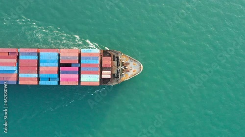 Aerial top view of cargo ship carrying container for import export goods  to customer,concept logistic and supply chain